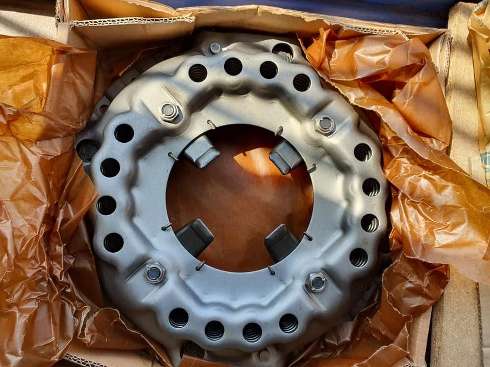A new tractor clutch pressure plate in its box at the Parts Connection counter